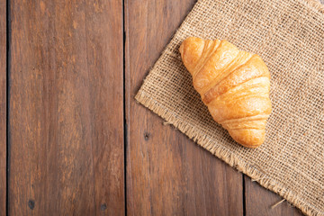 croissant on wooden background