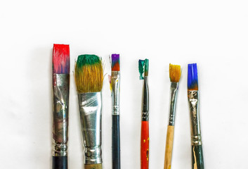 Obraz premium brush art painting on white paper, artist, a set of ideas of creative inspiration.