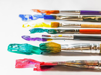 Obraz premium brush art painting on white paper, artist, a set of ideas of creative inspiration.