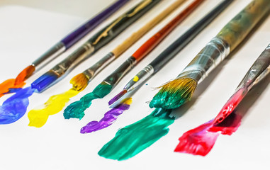 DIFFERENT ARTISTIC BRUSHES ON THE WHITE BACKGROUND,
