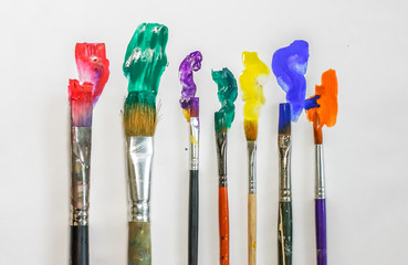 DIFFERENT ARTISTIC BRUSHES ON THE WHITE BACKGROUND,