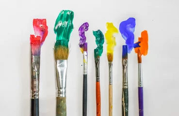 Fotobehang Schilderij DIFFERENT ARTISTIC BRUSHES ON THE WHITE BACKGROUND,  © kolyadzinskaya