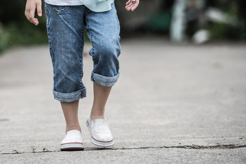 Woman jeans and sneaker shoes