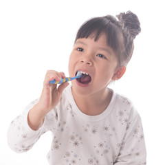 Little girl brushing her teeth isolated on white background