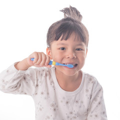 Little girl brushing her teeth isolated on white background