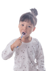 Little girl brushing her teeth isolated on white background