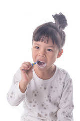 Little girl brushing her teeth isolated on white background