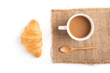 Coffee and croissant on white background