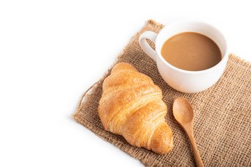 Coffee and croissant on white background