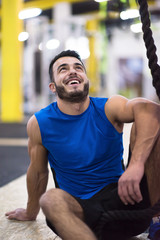 man relaxing before rope climbing