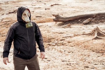 A man in protective suit works