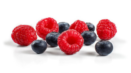 Mixed blueberries and raspberries isolated on white background