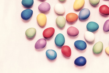 Fototapeta na wymiar Colorful Easter eggs on a white background. Easter holiday. Painted quail eggs