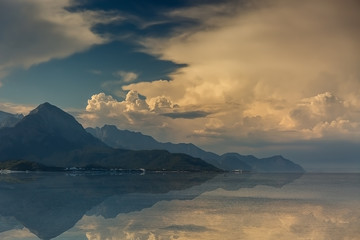 Beautiful mountains and clouds reflected in the sea of Kemer. Turkey.
