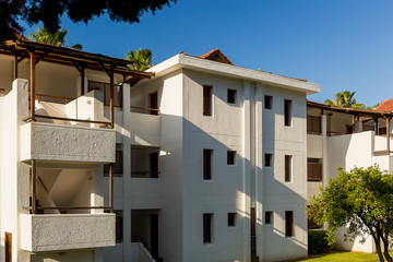 Fototapeta premium The building is a Motel in white color in Kemer. Turkey.