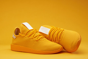 Yellow tennis shoes