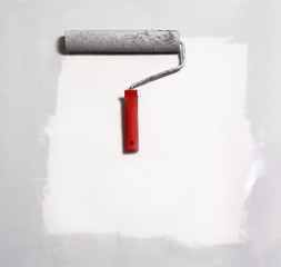 paint roller painting on white paper.background.