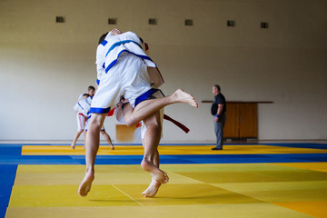 Fight of two athletes Asian Kuresh fight on the mat