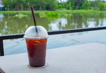 The Black coffee cool on the table, white in a restaurant on the raft.