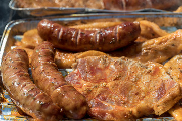 Unhealthy but tasty grilled sausages and meat