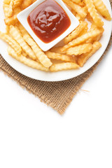 French fries with ketchup on wooden background.