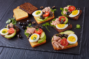 tuna sandwiches on a slate tray