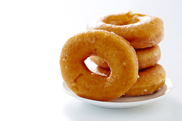 Donut isolated on a white plate