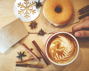 Cup of coffee and christmas  on wooden table