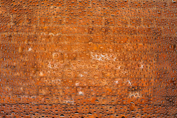 Close up of a water drops on a red old brick background, covered with drops of water -condensation.