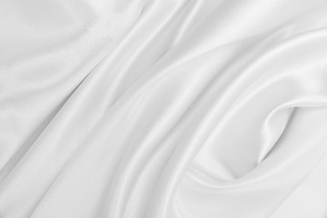 Obraz na płótnie Canvas Smooth elegant white silk or satin luxury cloth texture as wedding background. Luxurious background design