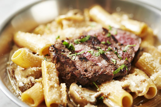 Beef steak with penne pasta 