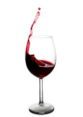 splash of red wine in a glass