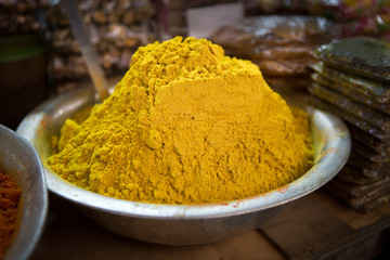 a scale with curry powder on a market in puducherry in the south of india