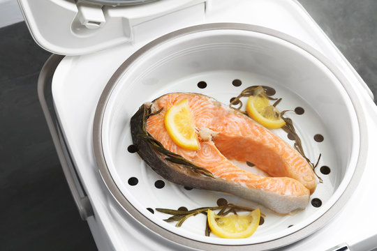salmon steak with spices and lemon prepare in the multivark