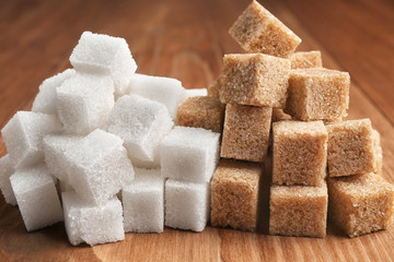 white and cane sugar refined on the table