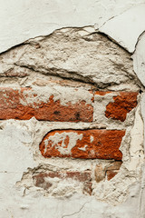 Background of an old weathered fragment of a brick wall