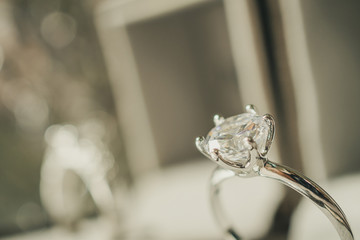luxury engagement Diamond ring in jewelry gift box with bokeh light background