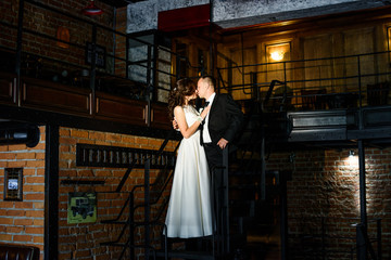 Bridal couple holding each other just after the wedding ceremony.