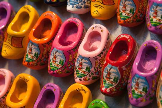 Perspective view closeup of colorful wooden dutch shoes. Souvenirs in Amsterdam shop