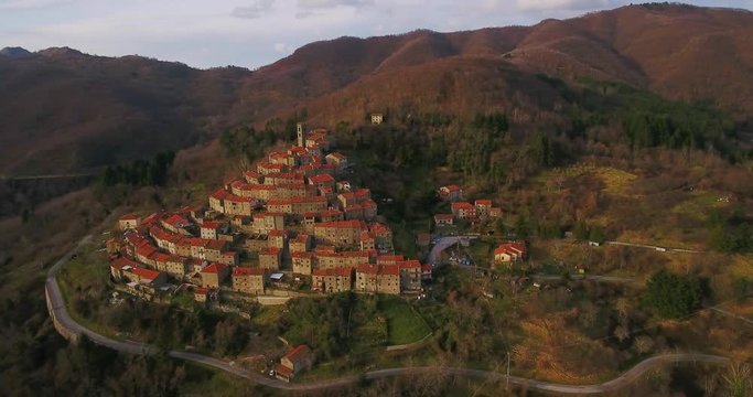 Aerial, beautiful little hamlet on the hill in Tuscany, Italy