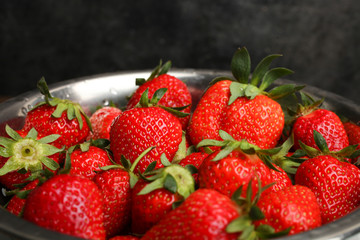 Ripe strawberries in a colander