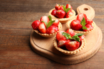 Ripe strawberries in tartlets