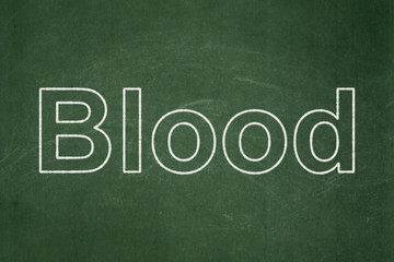 Obraz premium Health concept: text Blood on Green chalkboard background