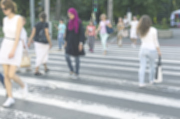 High blurred image of workers going back home after work. Unrecognizable faces.