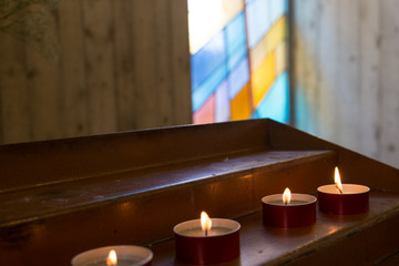 Row of ceremony candles in a modern church