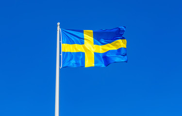 Flag of Sweden flying in the wind against the sky