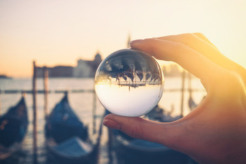 Venice gondola view through crystal glass ball