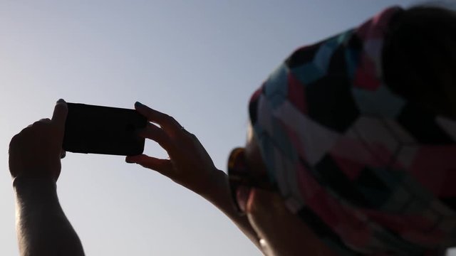 Young happy woman enjoy take selfie picture during summer sea beach leisure in Greece