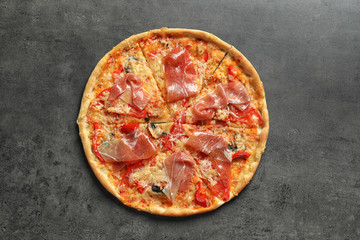 Delicious pizza with bacon on grey background