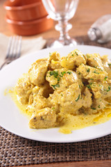 chicken cooked with curry and cream